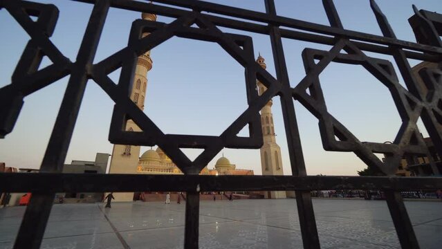 Hurghada, Egypt - 14 September, 2019: Mosque El Mina Masjid through the fance, with tourists visiting, famous tourist spot in Hirghada