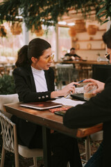 Business woman showing something on the laptop