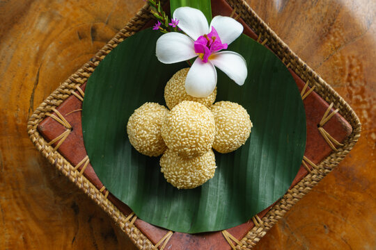 Overhead view of a bowl of traditional Indonesian Onde onde balls with sesame seeds