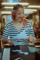 Tattoo artist laughing and cutting the design