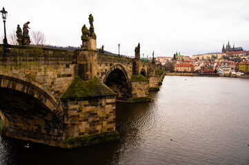 Obraz premium View of the Lesser Bridge Tower of Charles Bridge in Prague (Karluv Most) the Czech Republic. This bridge is the oldest in the city and a very popular tourist attraction.