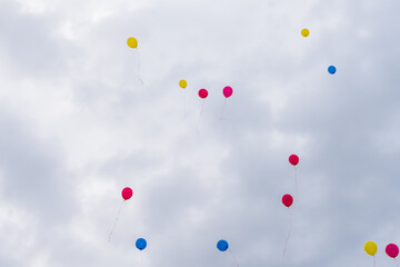 Balloons released into the sky on a festive day.