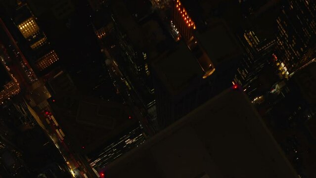 Aerial shot of generic North American featureless urban area. 4k night drone shot of the busy downtown streets
