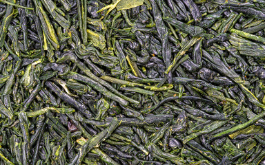 Feuilles de thé vert Gyokuro originaire du Japon - texture vu du dessus en haute définition - macro photographie