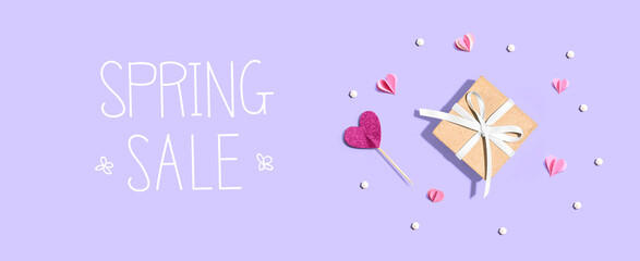 Spring sale message with a small gift box and hearts
