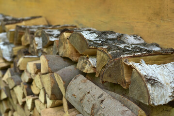 A lot of firewood lies in a heap