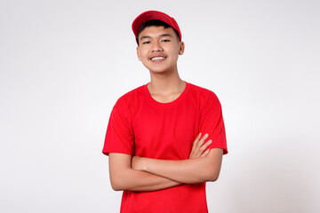 Courier Delivery worker shipping concept. Portrait of Smiling young asian Delivery man in red uniform isolated on white background