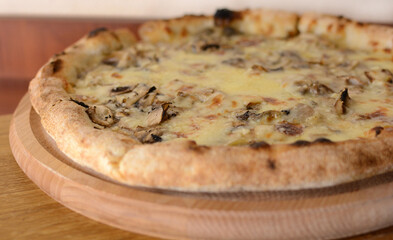 Delicious pizza with mushrooms close-up 