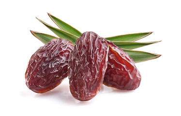 Dates fruit with leaves in closeup on white background