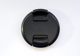 black cap for the lens on a white background. Locks on both sides