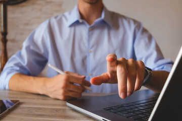 Businessman touching the screen with a stylus in hand. For business illustration floating screen...