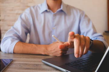 Businessman touching the screen with a stylus in hand. For business illustration floating screen...