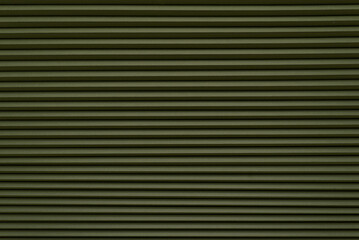 Fototapeta premium Roller blinds on the window. The texture of roller blinds. Background of stripes