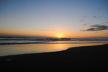 Sunrise at the beach. First sunbeam. Quite beach