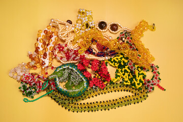 Beads, Jewelery, beads necklace on yellow background. 