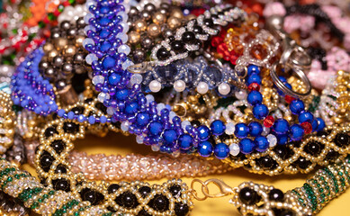 Beads, Jewelery, beads necklace on yellow background. 