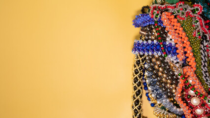 Beads, Jewelery, beads necklace on yellow background. 