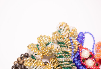 Bead jewelery on white background.