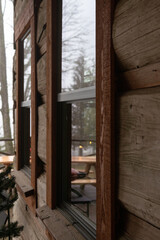 Fototapeta na wymiar forest reflection in a cabin window