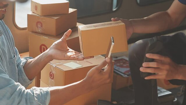 Business woman start up small business entrepreneur SME success .freelance woman working at home with Online Parcel delivery. SME and packaging deliveryconcept