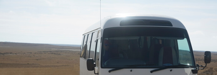 new modern 21 Seater Bus Tourist.  mini bus on volley background. Touristic and travel concept....