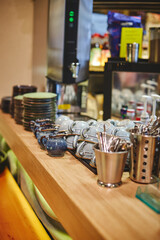 Pan-Asian cafe interior, bar counter with crockery