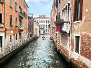 Fototapeta na wymiar Canal of Venice. Beautiful venetian street. Special beauty of architecture