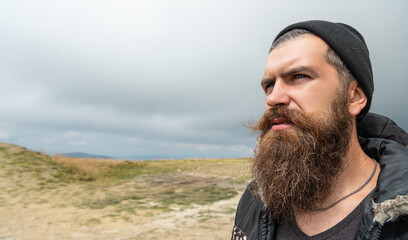 photo of caucasian man in the mountain, copy space banner. caucasian man outdoor