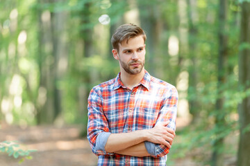 photo of caucasian man style in the forest. caucasian man outdoor. caucasian man has stubble