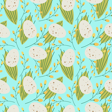 Cute repeating seamless pattern for easter on a light blue background.Unpainted natural quail egg in a pattern with mimosa branches and flowers, green leaves.Easter background for textiles and design