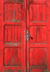 Fototapeta na wymiar old closed and weathered brown wooden door,