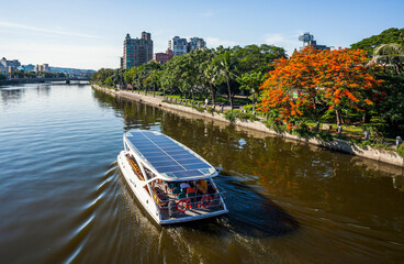 The solar-powered ferry is sailing in the Love River in Kaohsiung, Taiwan.