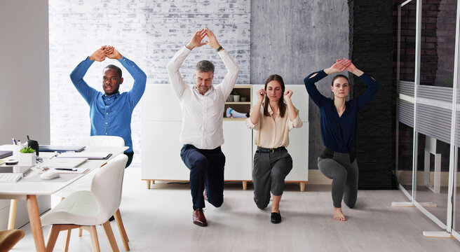 Happy Young Businesspeople Doing Stretching Exercise