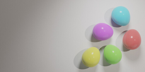 Colored easter eggs on white textured surface.