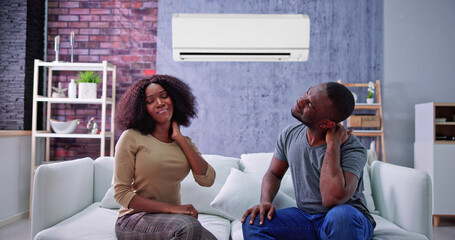 Happy Family Using Air Condition