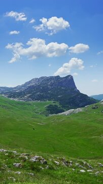 Landscape with mountains in the park Durmitor, Montenegro, timelapse. Vertical video
