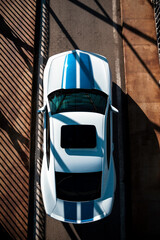 white and blue sports car top view fast sport with sunset light