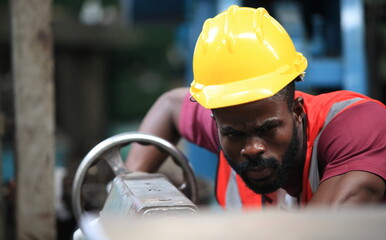 engineer checking auto parts in factory