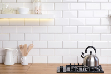 Kettle in white spacious luxury modern kitchen interior