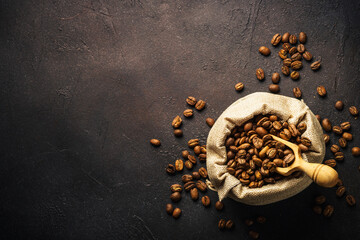 Roasted coffee beans in burlap bag.