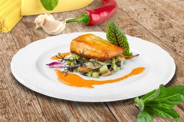 Tasty fresh Dish with fish fillet and salad
