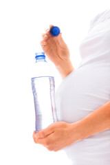 beautiful young pregnant girl on a white background with a bottle