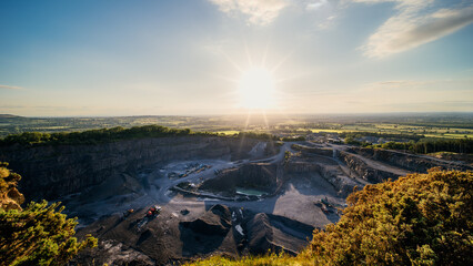 Panoramic view on Allen Quarry next to Allen Hill with heavy machinery in operation at sunny day in...