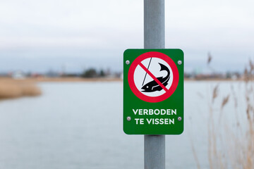 Dutch fishing prohibited sign near lake - NO FISHING - obrazy, fototapety, plakaty