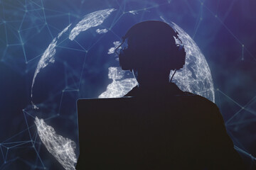 Silhouette of a military man in headphones at a laptop against the background of a digital globe of the earth, contour lighting. Concept: collection of confidential information, surveillance and contr - obrazy, fototapety, plakaty