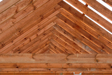 A timber roof truss of a house under construction