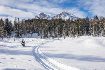 winter mountain landscape with scooter track