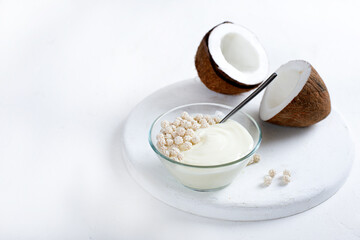 Fototapeta na wymiar Coconut yogurt on white background