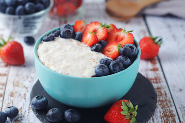Milk rice with berries ready for breakfast