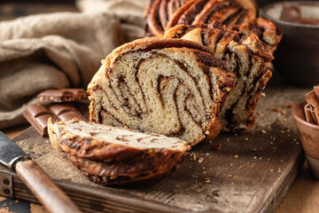 Chocolate Babka or Brioche Bread. Homemade sweet yeast pastry chocolate swirl bread sliced on...